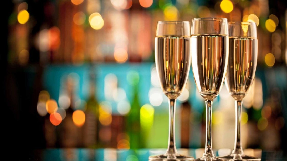 Close-up of 3 full Champagne flutes
